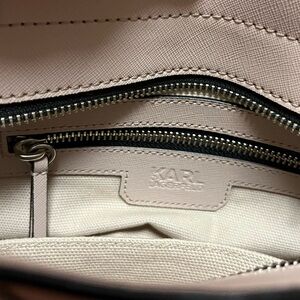 Stunning new handbag with iconic Karl lagerfield logo .